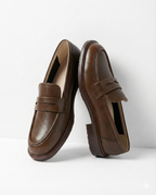 Women's penny loafers with apron stitching and low heel