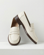 Women's penny loafers with apron stitching and low heel
