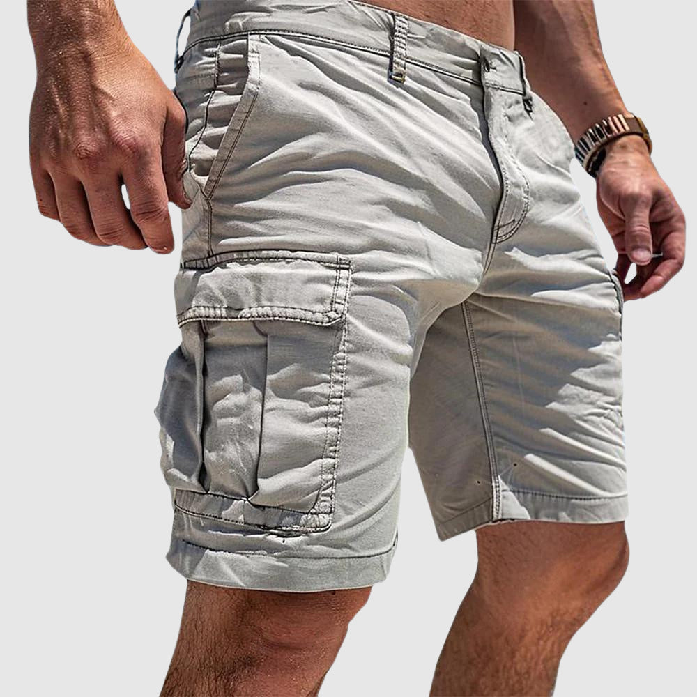Men's knee-length cargo shorts with flap pockets and belt loops