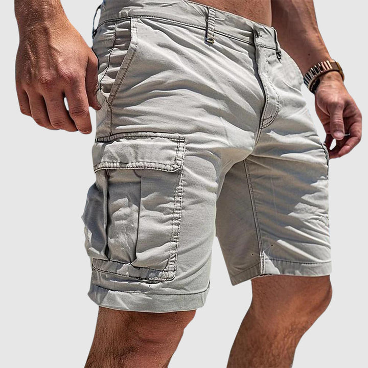 Men's knee-length cargo shorts with flap pockets and belt loops