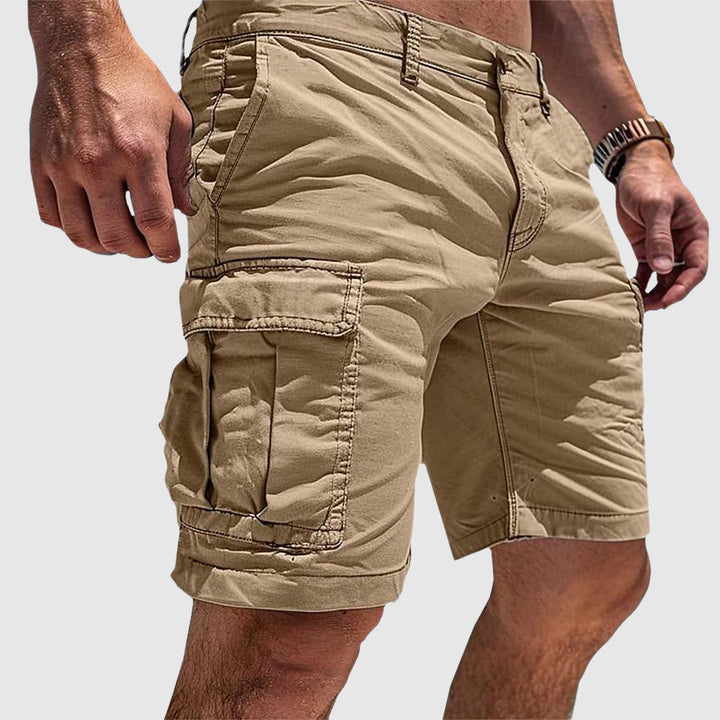 Men's knee-length cargo shorts with flap pockets and belt loops