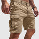 Men's knee-length cargo shorts with flap pockets and belt loops