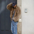 Women's brown faux fur jacket with a hooded collar
