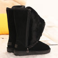 Black tall winter boots with furry trim, side zips and flat ridged soles