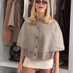 Women's grey knitted cape cardigan with buttons and ribbed trim