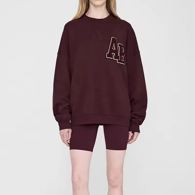 Women's crew-neck sweatshirt with long sleeves and embroidered front design