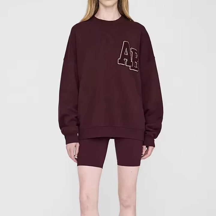 Women's crew-neck sweatshirt with long sleeves and embroidered front design