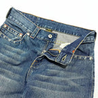 Blue Batman graphic jeans with wide legs and rear pocket patches