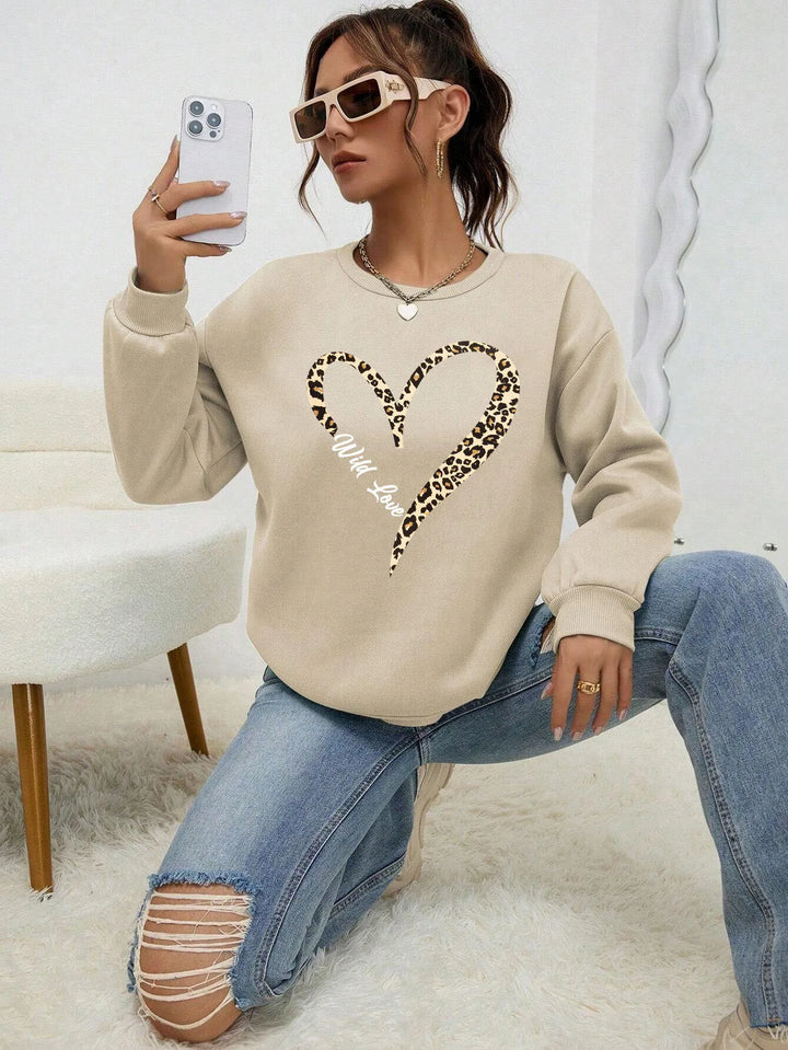 Women's crew-neck sweatshirt with leopard heart graphic and long sleeves