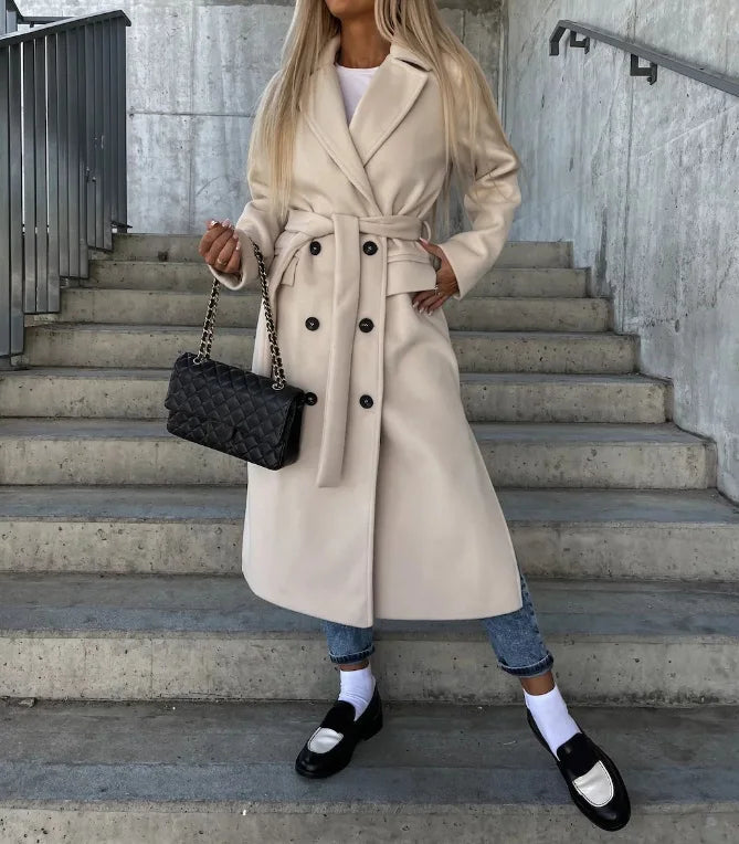 Women's long belted trench coat with notched lapels and double-breasted buttons