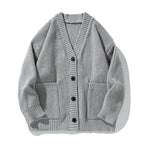 Women's oversized ribbed V-neck cardigan with buttons and patch pockets