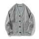 Women's oversized ribbed V-neck cardigan with buttons and patch pockets