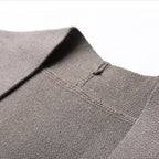 Men's striped knit cardigan with button front, long sleeves and patch pockets