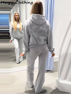 Women's hooded hoodie with large sequin wing motifs on the back