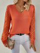 Women's V-neck knitted jumper with long openwork sleeves