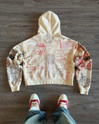 Beige hooded zip hoodie with postal stamp graphics and long sleeves