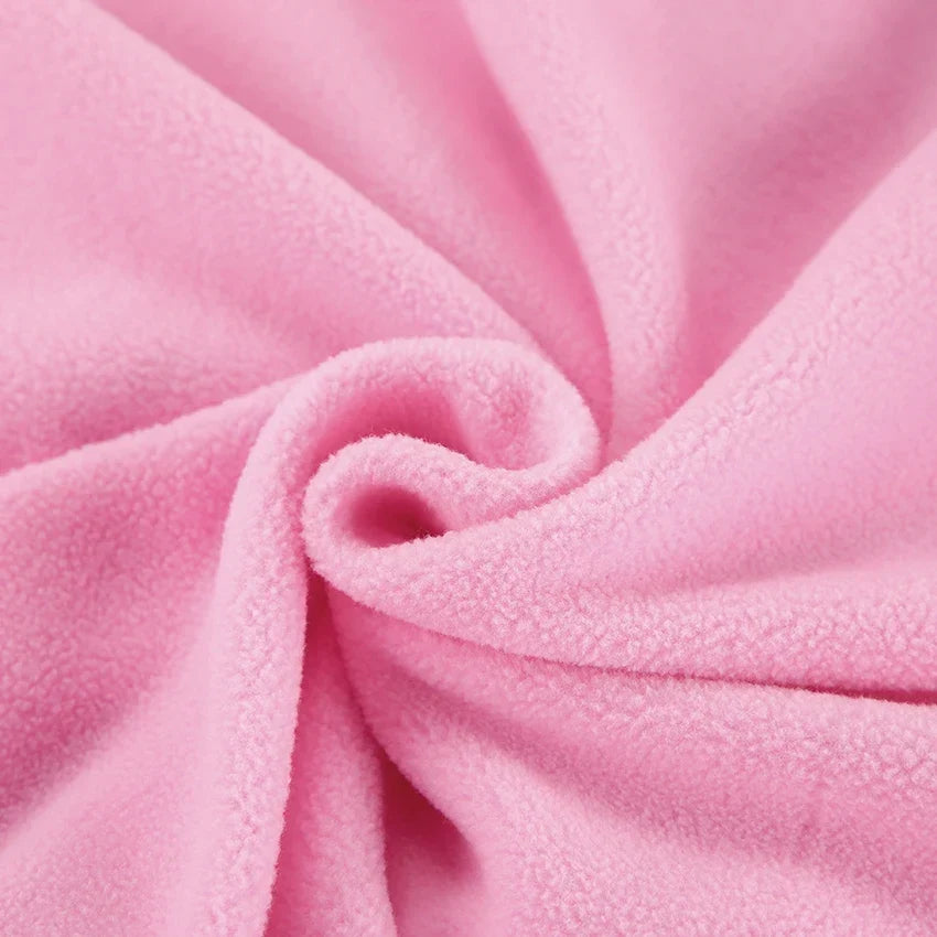 Women's pink textured pullover with stand collar and quarter-zip front