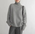 Women's cream turtleneck sweater with ribbed trims