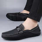 Men's slip-on loafers with moc toe stitching and metal bit detail