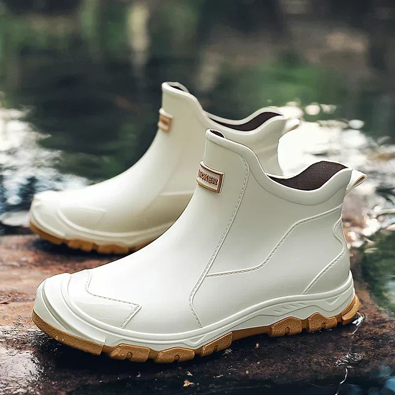 Women's Chelsea-style ankle rain boots with round toes and lugged soles