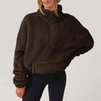 Women's textured hooded half-zip sweater with long sleeves and front pocket