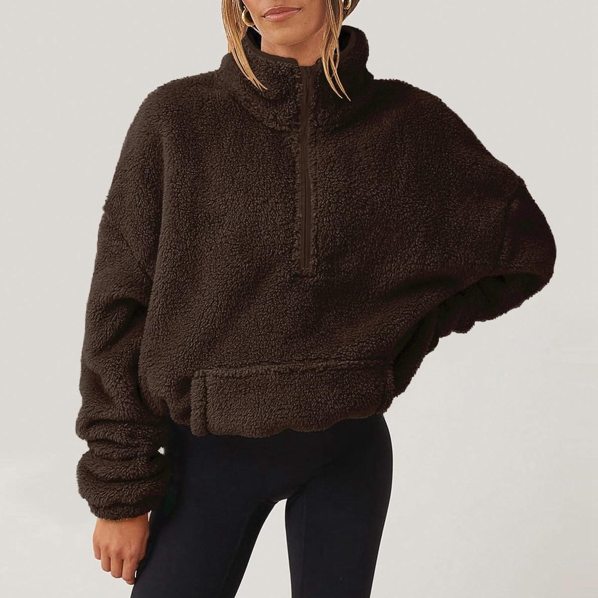 Women's textured hooded half-zip sweater with long sleeves and front pocket