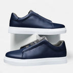 Men's low-top lace-up sneakers with panelled upper and flat white sole