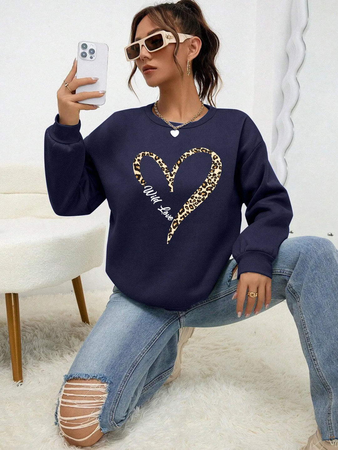 Women's crew-neck sweatshirt with leopard heart graphic and long sleeves
