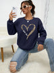 Women's crew-neck sweatshirt with leopard heart graphic and long sleeves