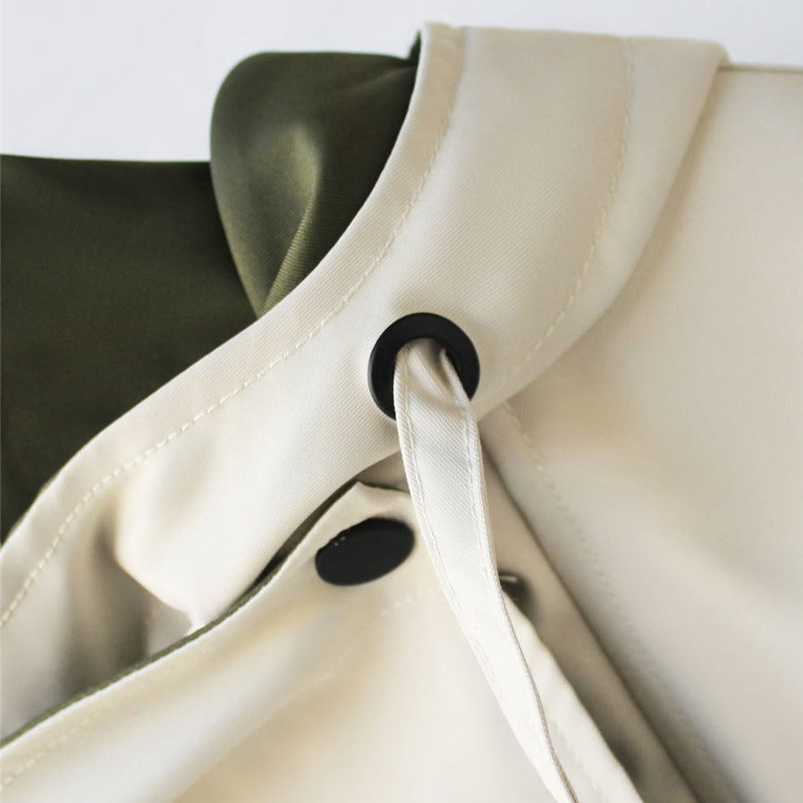 Women's hooded windbreaker jacket with contrast panels and drawstrings