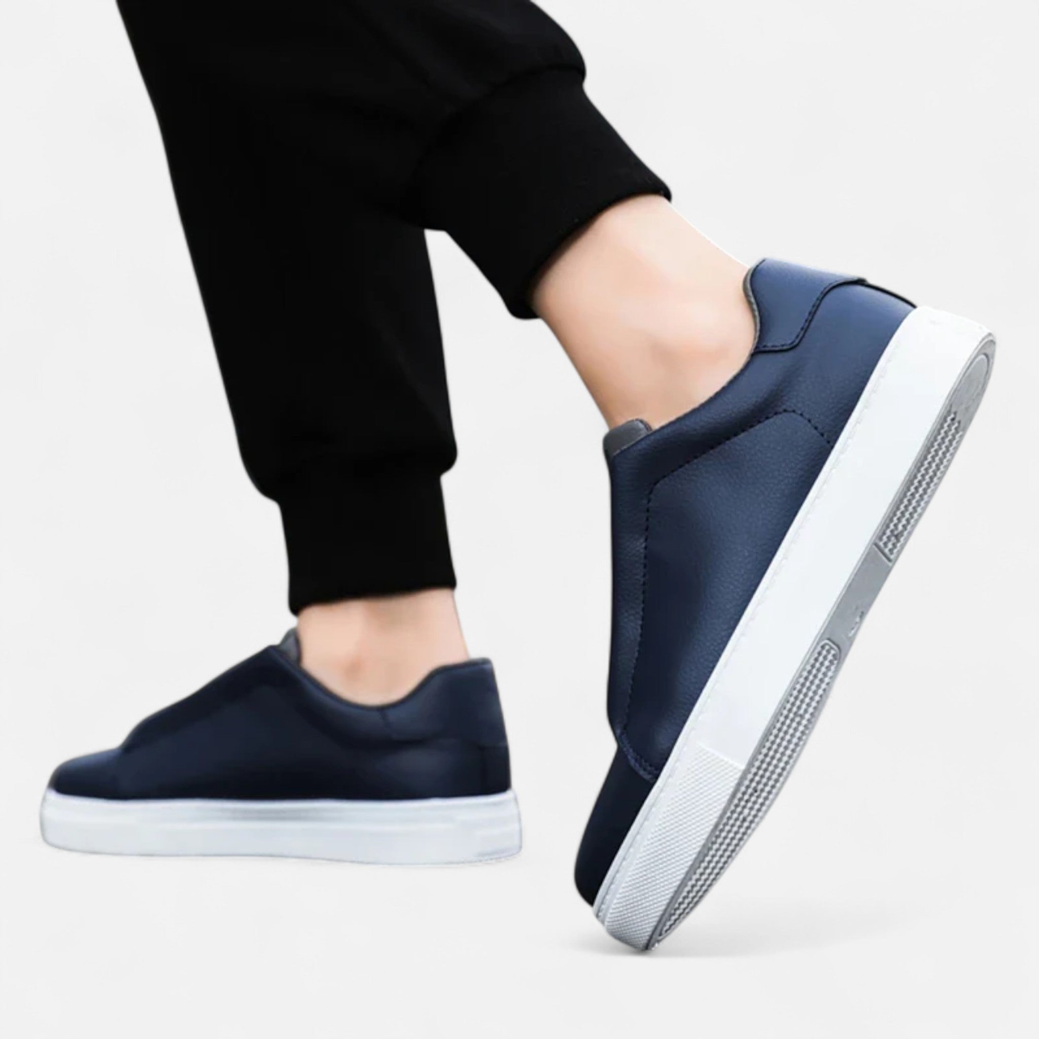 Men's low-top lace-up sneakers with panelled upper and flat white sole