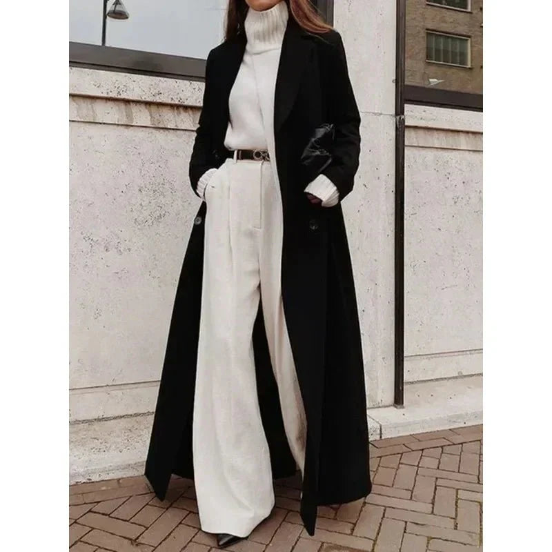 Women's long black maxi coat with notched lapels and button front