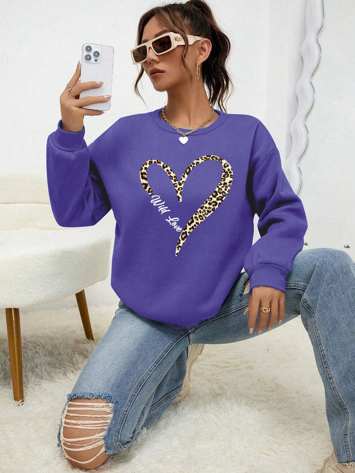 Women's crew-neck sweatshirt with leopard heart graphic and long sleeves