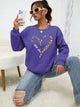 Women's crew-neck sweatshirt with leopard heart graphic and long sleeves