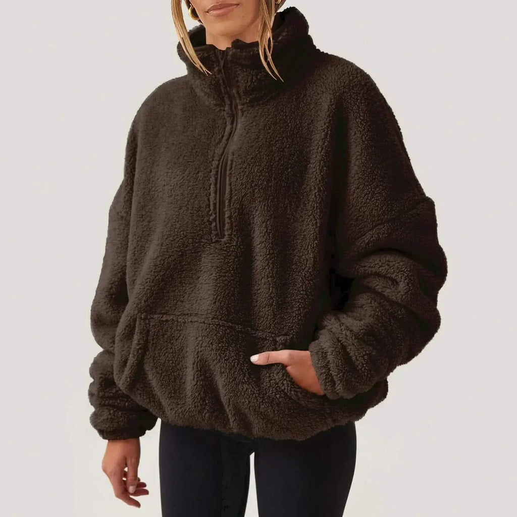 Women's textured hooded half-zip sweater with long sleeves and front pocket