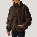 Women's textured hooded half-zip sweater with long sleeves and front pocket