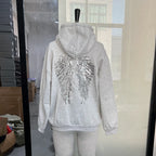 Women's hooded hoodie with large sequin wing motifs on the back