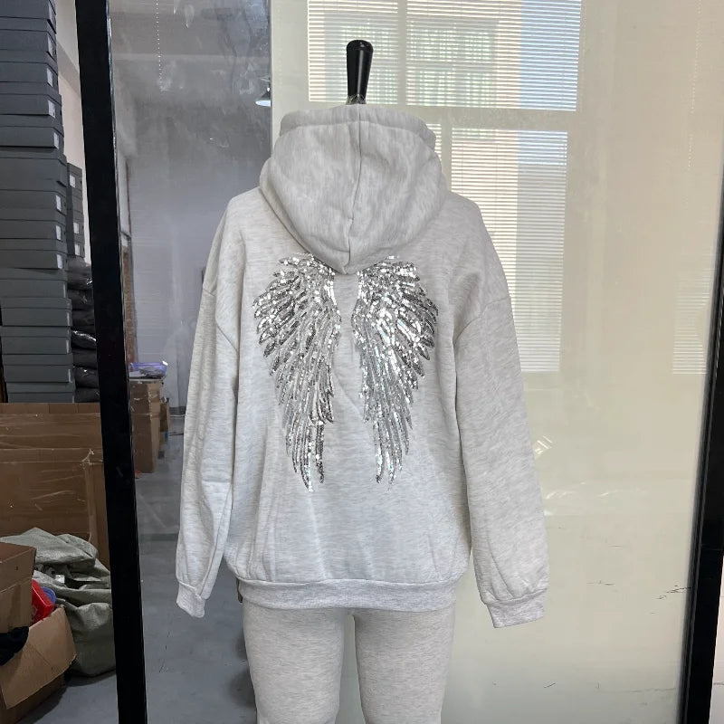 Women's hooded hoodie with large sequin wing motifs on the back