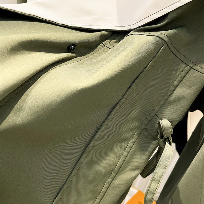 Women's hooded windbreaker jacket with contrast panels and drawstrings