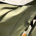 Women's hooded windbreaker jacket with contrast panels and drawstrings