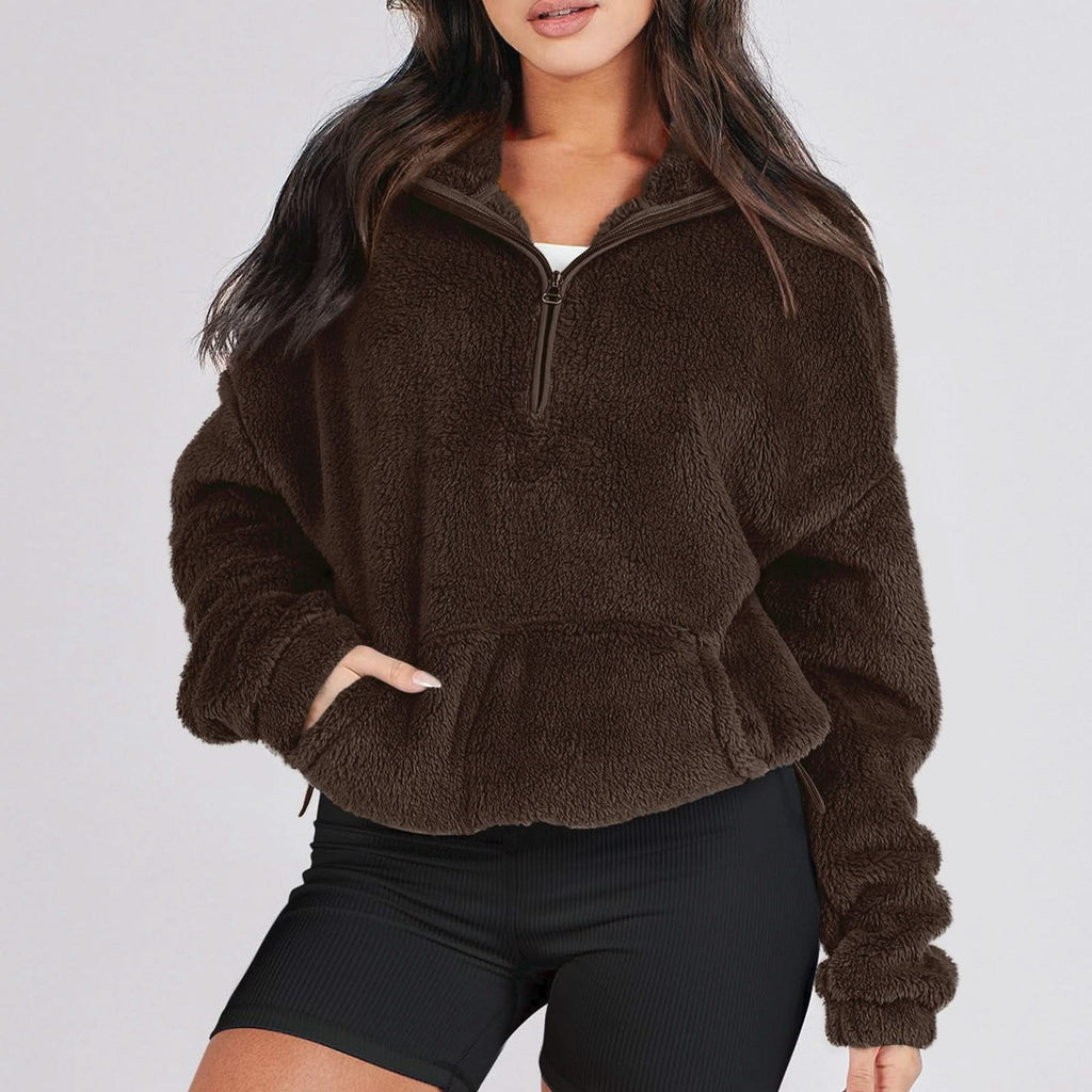 Women's textured hooded half-zip sweater with long sleeves and front pocket