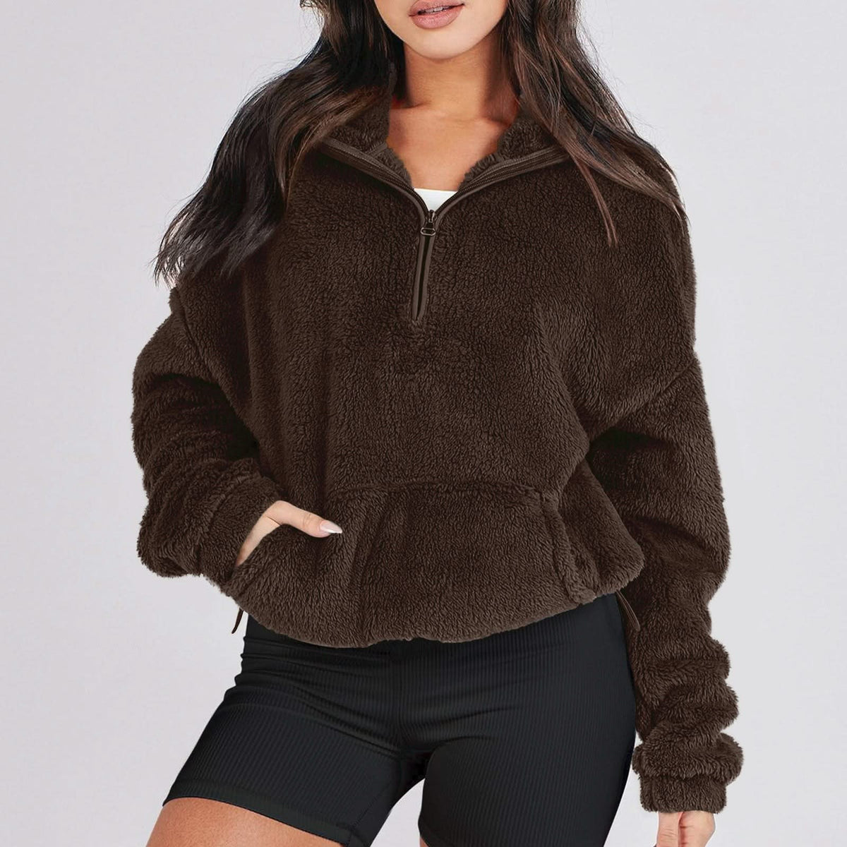 Women's textured hooded half-zip sweater with long sleeves and front pocket