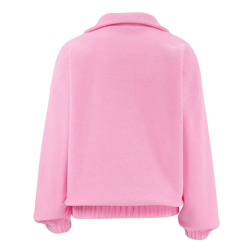 Women's pink textured pullover with stand collar and quarter-zip front