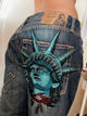 Dark wash wide-leg jeans with a Statue of Liberty back graphic