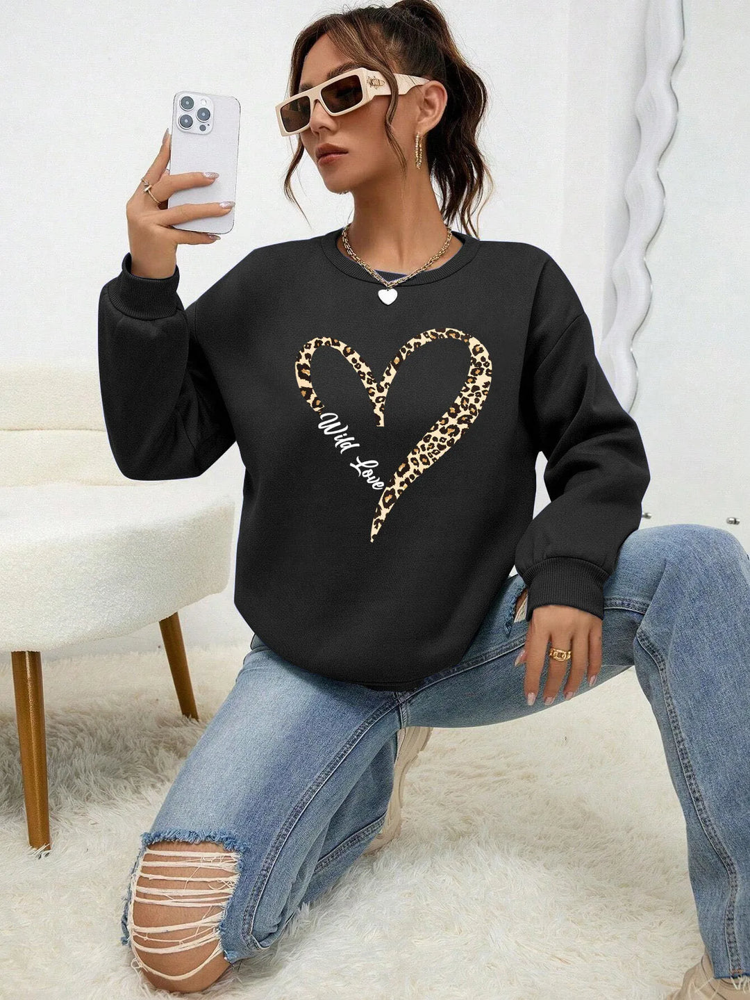 Women's crew-neck sweatshirt with leopard heart graphic and long sleeves