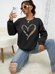 Women's crew-neck sweatshirt with leopard heart graphic and long sleeves