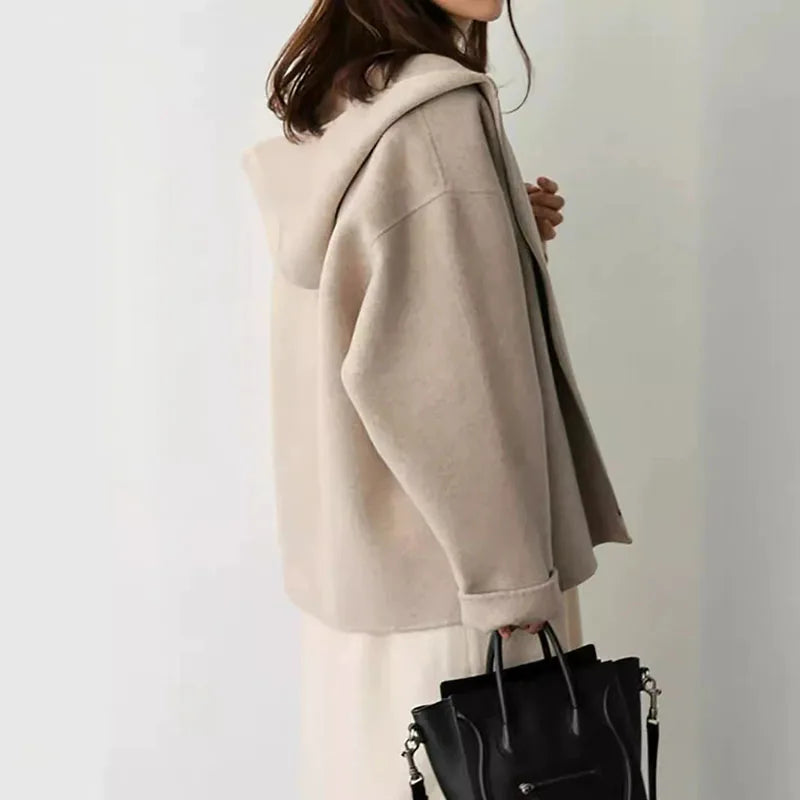 Women's hooded zip jacket with long sleeves and front pockets in beige and black