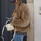 Women's brown faux fur jacket with a hooded collar