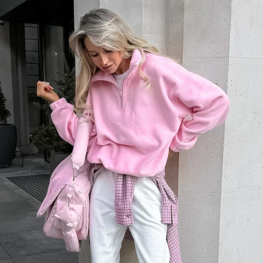 Women's pink textured pullover with stand collar and quarter-zip front