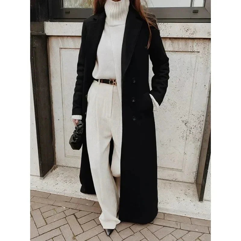 Women's long black maxi coat with notched lapels and button front